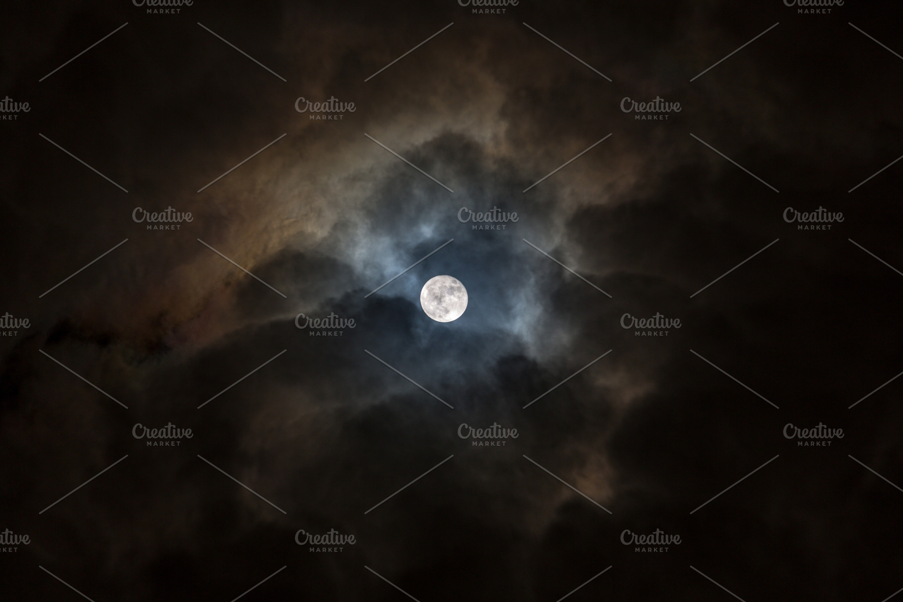 Full moon in a dark cloudy sky, a Nature Photo by misign