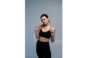 Young woman posing with a measuring, a Sports & Recreation Photo by volodymyrshtun13795