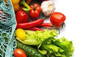 Fresh organic vegetables in a reusable mesh bag, a Photo by Olena Rudo