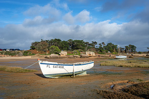 Beached white boats resting on tidal meadow in Tregastel, Britta, a Nature Photo by GoodGoods