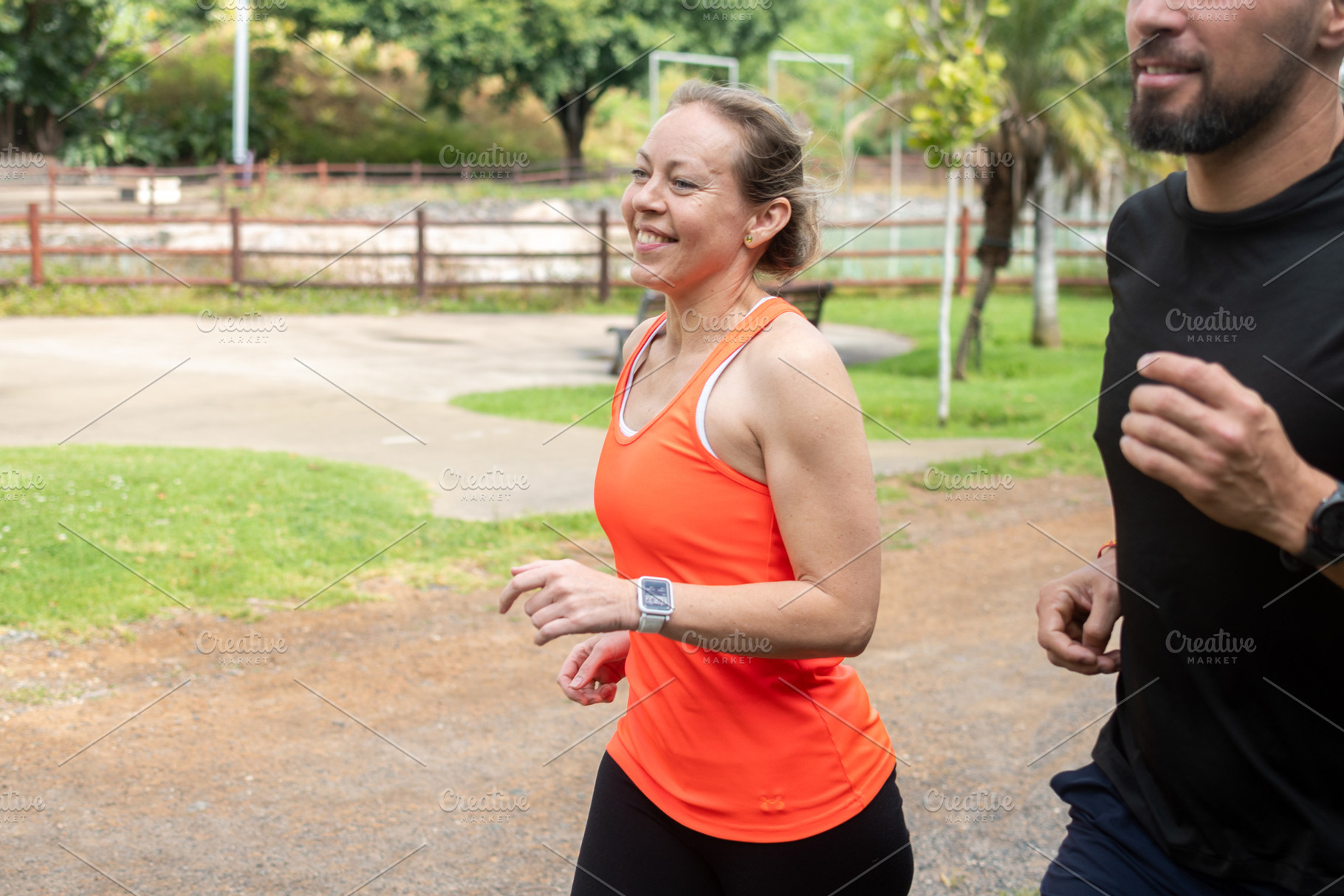 Happy athletic couple jogging together, a Sports & Recreation Photo by etorres69