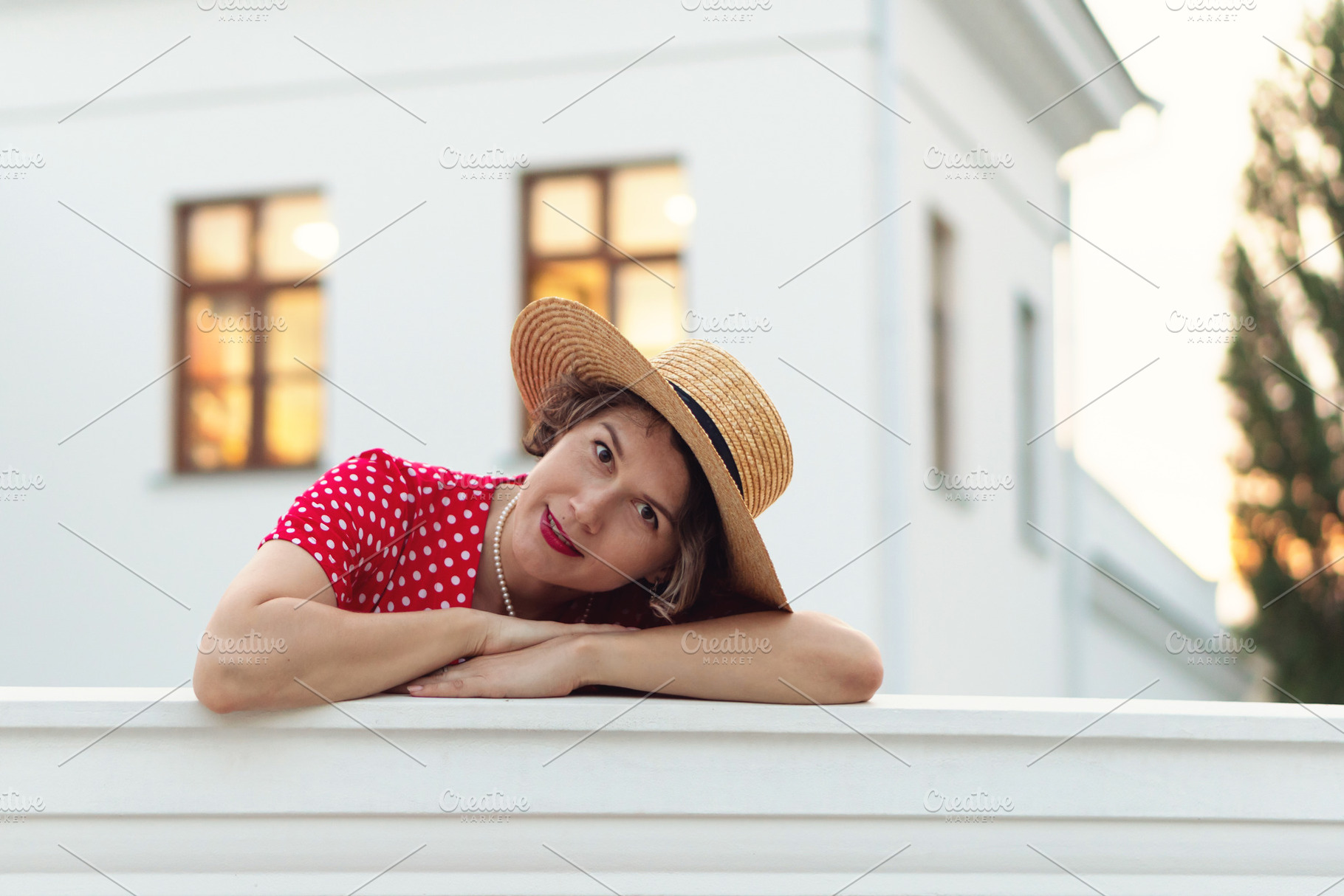 Woman in red polka-dot dress rests, a Person Photo by Elena Vagengeim