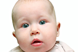 Newborn baby close up, a Photo by saiko3p