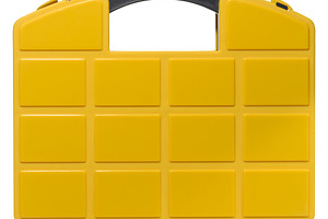 Yellow plastic organizer for storing small parts with black hand, an Industrial Photo by ndanko