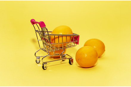 Oranges in an iron grocery cart on a, a Food & Drink Photo by shahin.mammadov