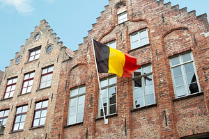 Belgian national flag on a building, an Architecture Photo by BOOCYS