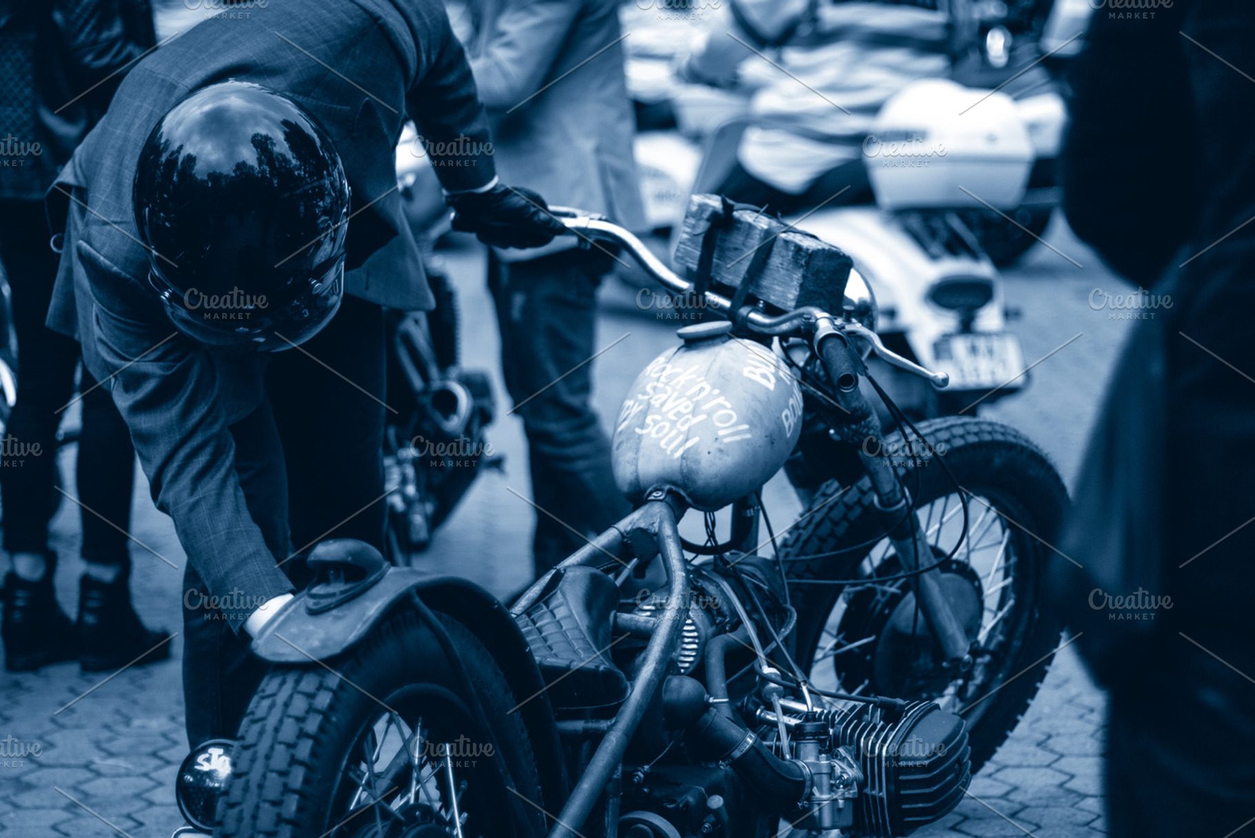 Gentleman starting his bike, a Transportation Photo by rtyc