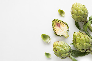 Artichokes on a white background, a Photo by Beautiful things