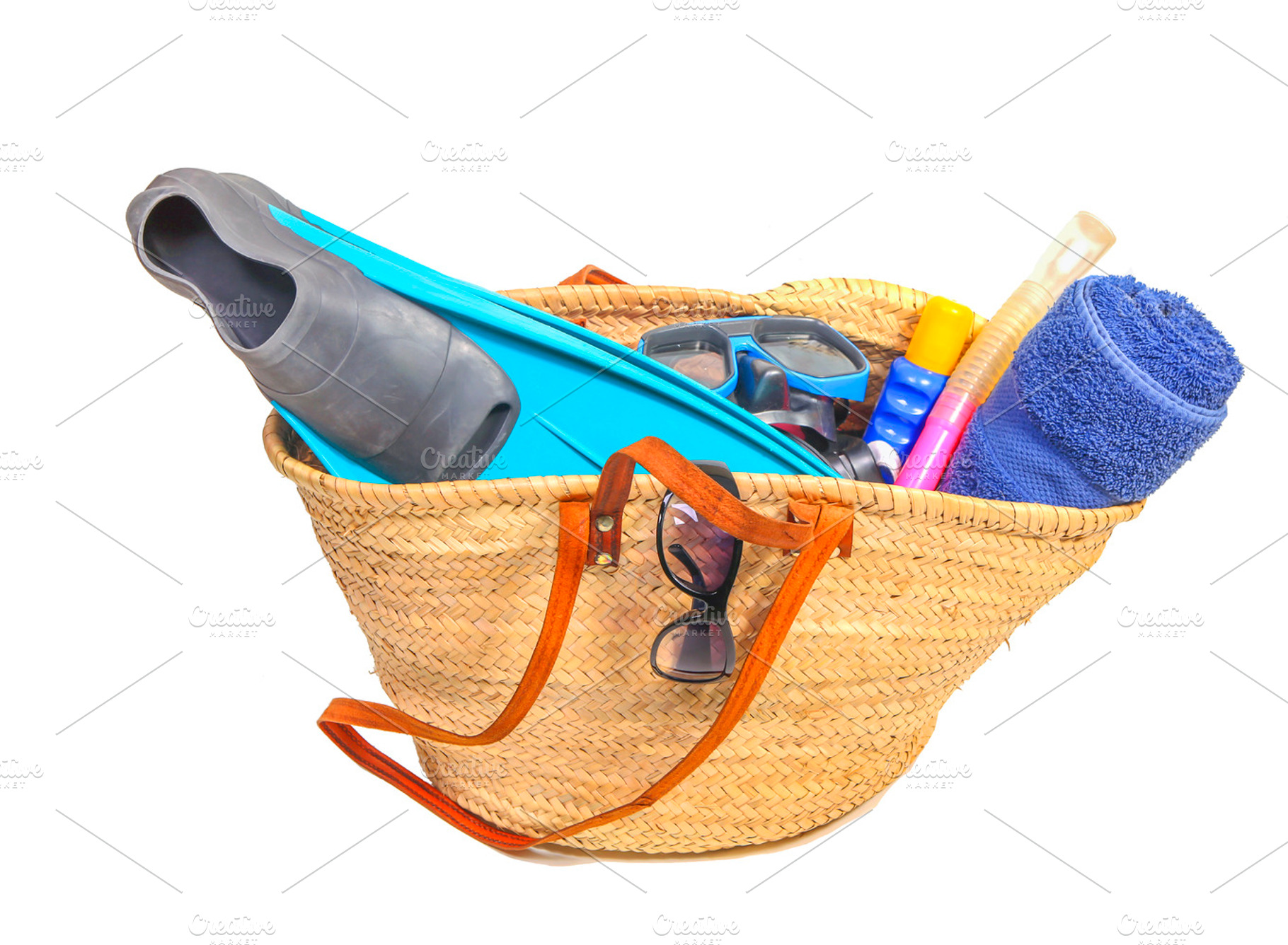 Basket filled with beach items containing basket, isolated, and specs