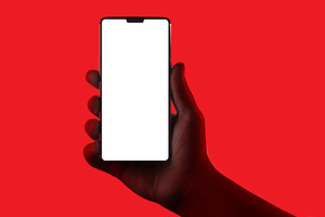 Hand holding phone featuring phone, hand, and holding