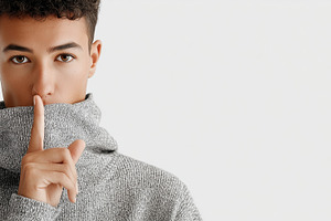 Young man in a gray sweater making, a Person Photo by MistyDay