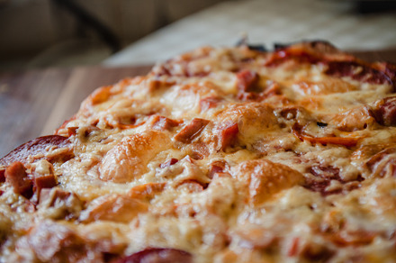 homemade pizza close-up raw and ready-made. Top view, copy space, a Background Photo by TanaCh