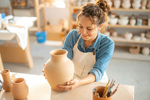 Young Female Potter Shaping Clay Vase, an Arts & Entertainment Photo by Davizro's Market