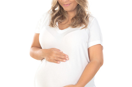 Young beautiful blonde woman pregnant expecting baby over isolat, a Person Photo by José Manuel Gelpi