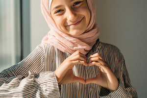 Smiling Muslim Girl Wearing Hijab, a Person Photo by Virgo Studio