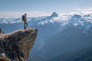 Hiker on rock ledge, a Photo by Beautiful things