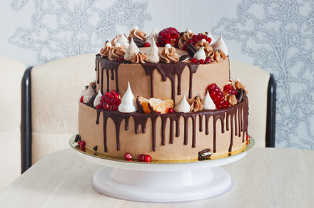 Festive twotier cake featuring cake, chocolate, and food