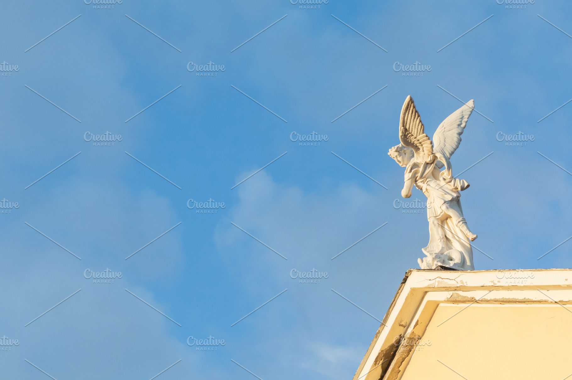 Saint Michael the Archangel statue placed on top of a church wit, a Holiday Photo by Antonio Gravante Market
