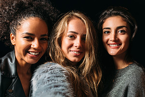 Three beautiful women taking selfie, a Person Photo by Artem Varnitsin