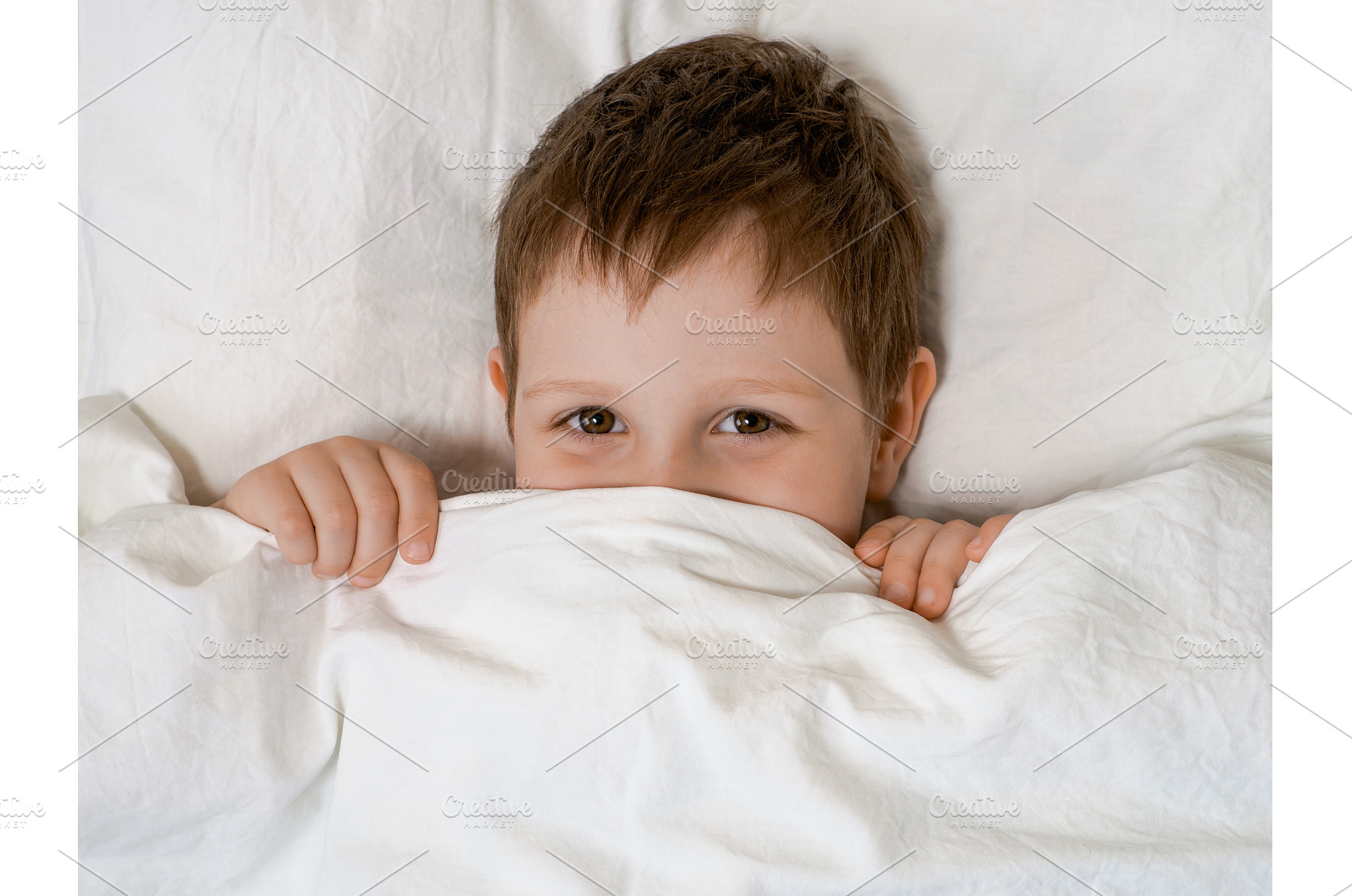 Young boy in bed before going to, a Person Photo by Fascinadora