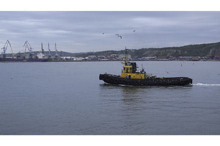 Fishing boat on background of port, a Nature Photo by Media Whale Stock