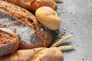 Assortment of fresh baked bread, grain, and flour, a Food & Drink Photo by Olena Rudo