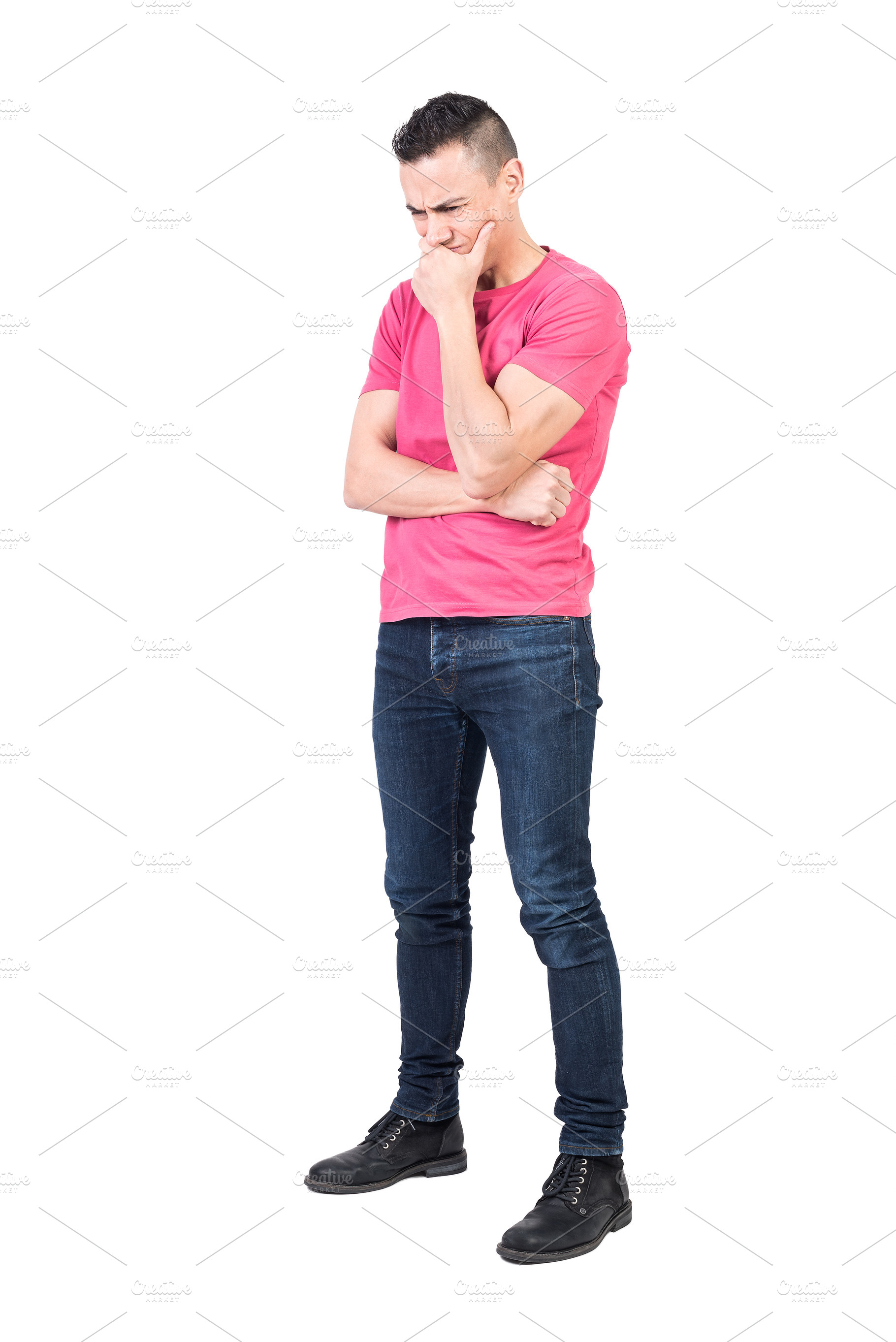 Frowning man worrying about problem in studio, a Background Photo by Iván Moreno STOCK PHOTO