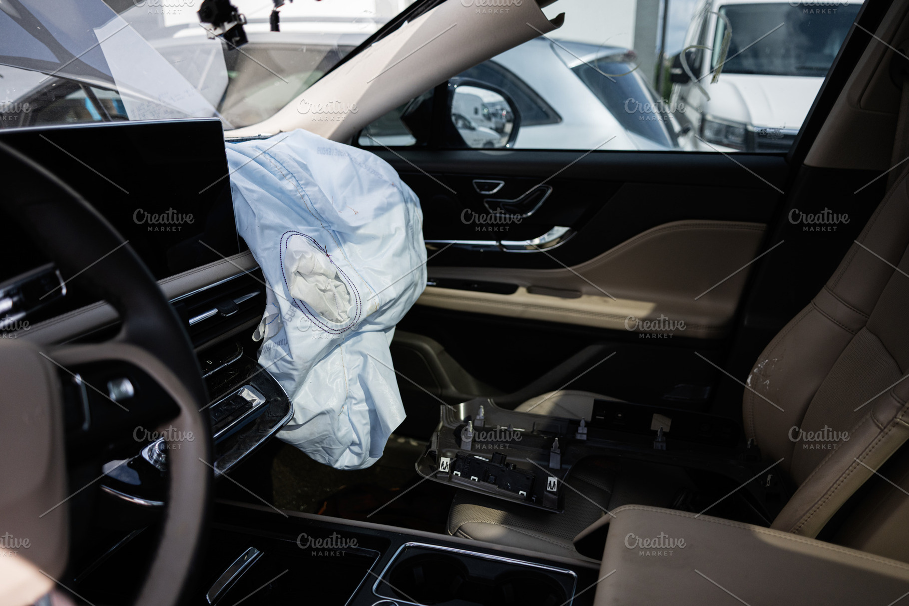Interior of a car with deployed airbag after an accident or collision, a Transportation Photo by AS photostudio