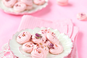 Rose meringue cookies containing background, baked, and buds
