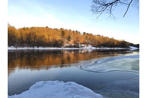 Partially frozen river on clear day, a Nature Photo by Tati_Kli