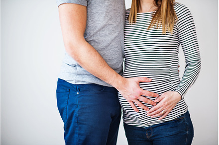 Pregnant woman and her partner, a Person Photo by HalfPoint