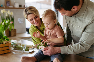 Family eating green dishes as a, a Food & Drink Photo by HalfPoint