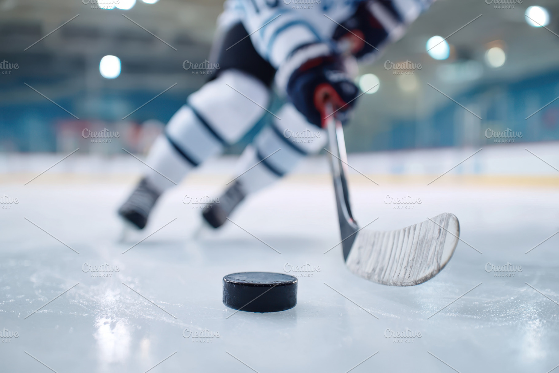 Hockey Player in Action on Ice Rink, a Sports & Recreation Photo by AlyaAnd
