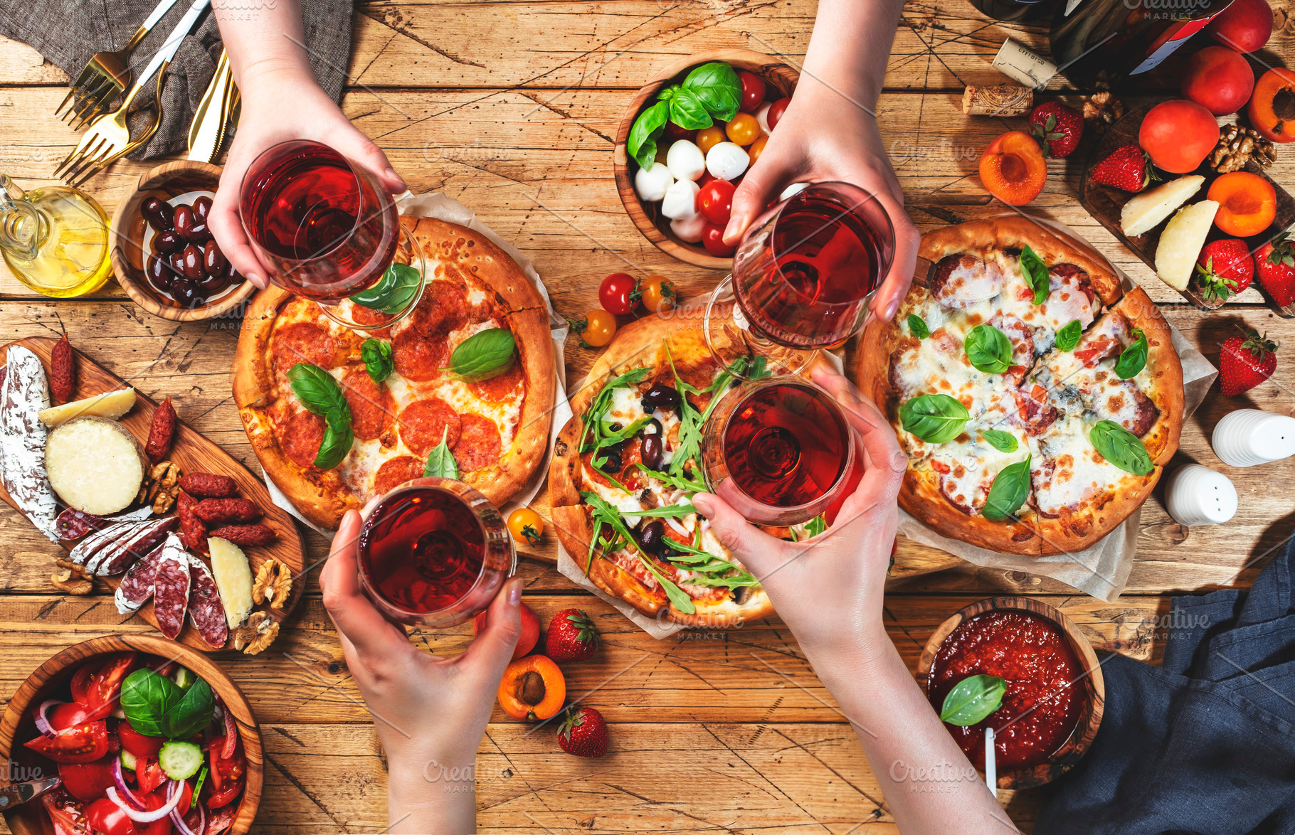 Pizza party with friends. Top view people holding glasses with r, a Food & Drink Photo by 5PH