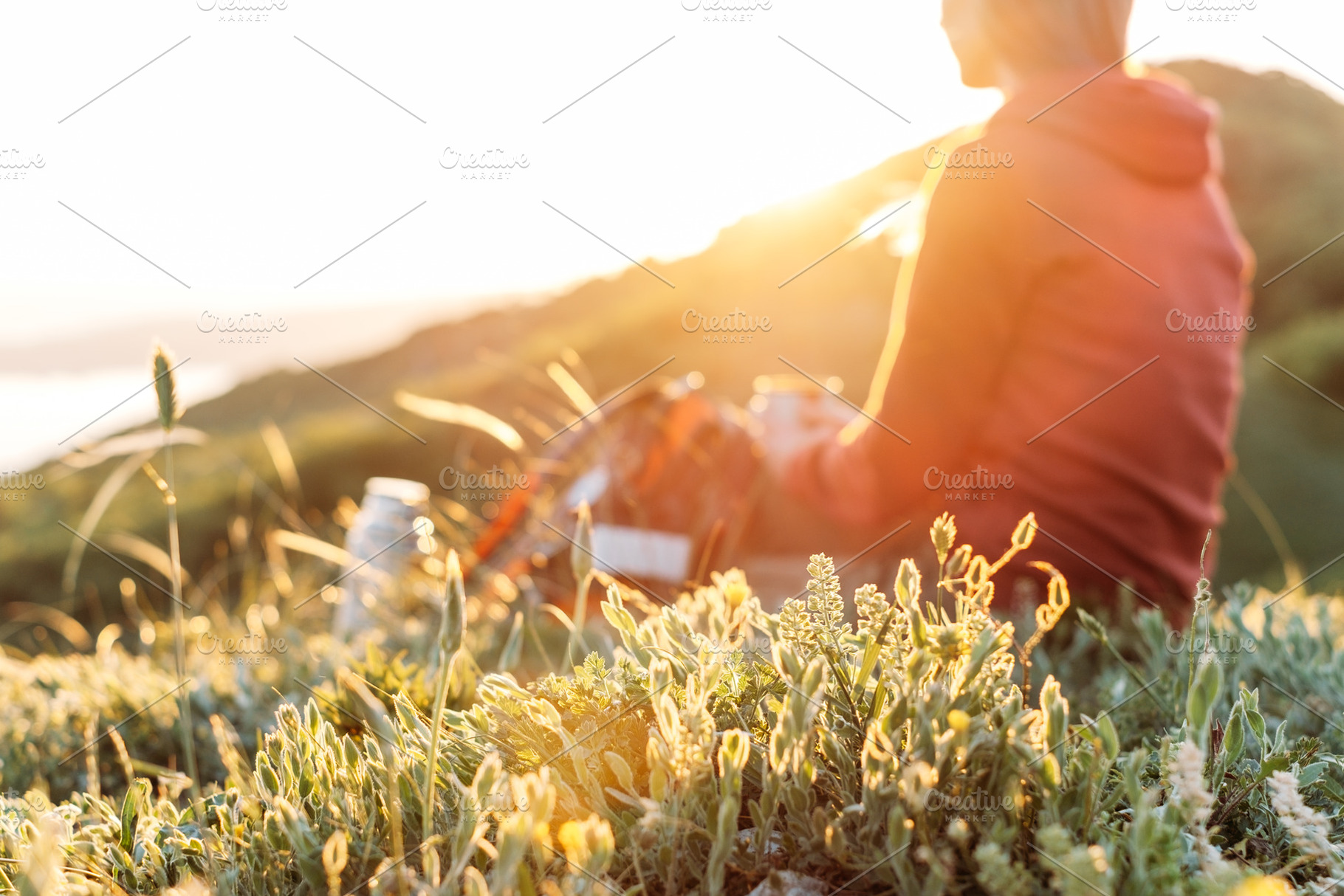 Hiker resting outdoor at sunset., a Person Photo by P&G