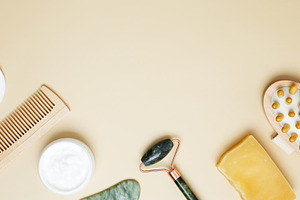 Self care skincare collection with marble roller, gua sha and cosmetic products