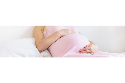 A pregnant woman in bed hugs her, a Person Photo by yanadjana