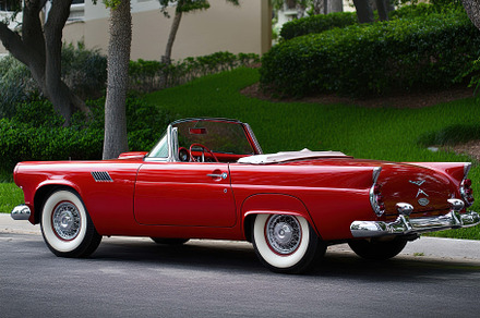 Classic Red Convertible Parked on a, a Photo by Tanuart