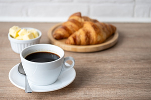 Black coffee with fresh croissants, a Food & Drink Photo by etorres69