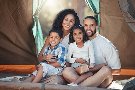 Happy family, children and camping in tent for fun, adventure and bonding with mom and dad on trip in nature. Portrait of woman, man and children together to relax on summer camp or vacation outdoors, a Photo by Peopleimages.com
