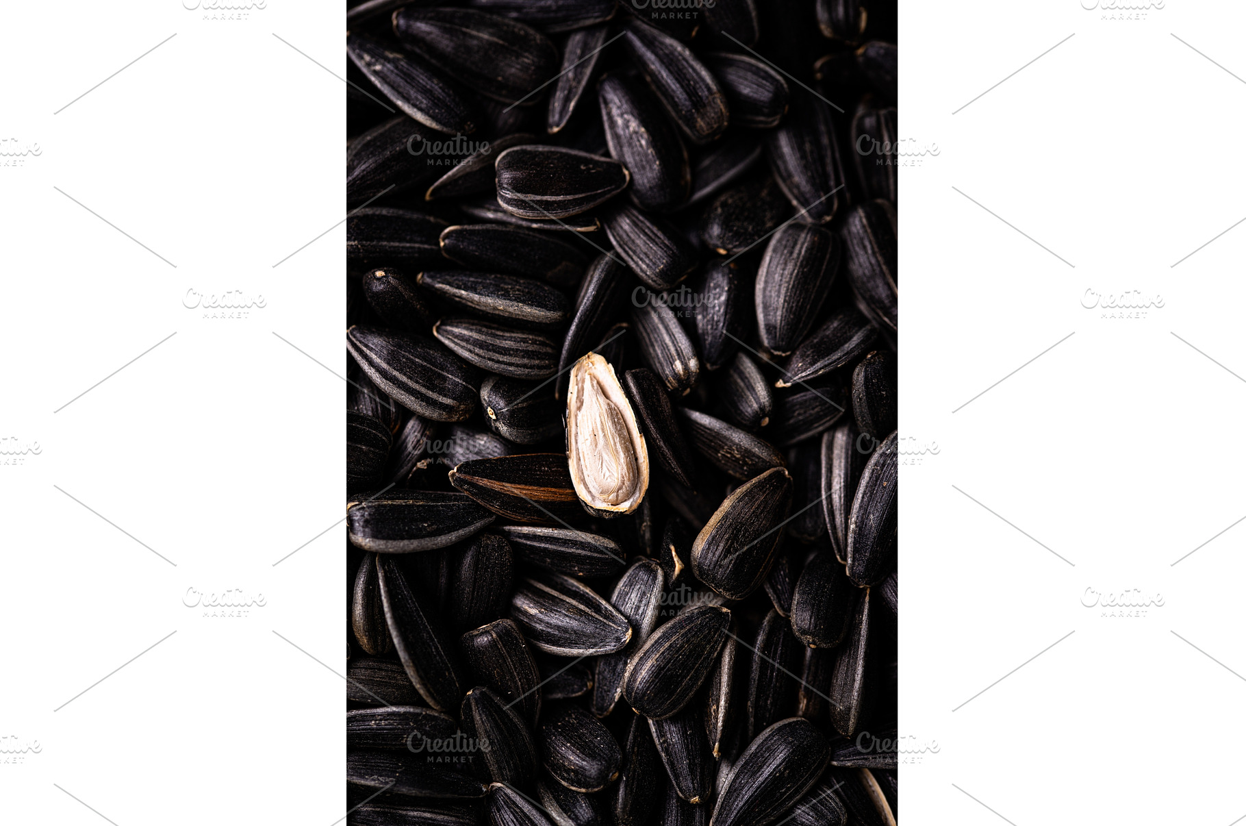 Pile of black sunflower seeds close, a Food & Drink Photo by Yulia Furman