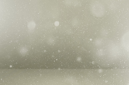 Snow flake particles on grey background, a Holiday Photo by GoodGoods