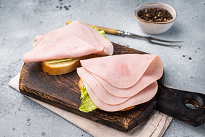Freshly made ham sandwich on artisanal bread, inviting you to en, a Food & Drink Photo by composter-box@mail.ru