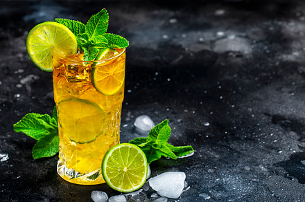 Dark and Stormy cocktail drink with dark rum, ginger ale, lime a