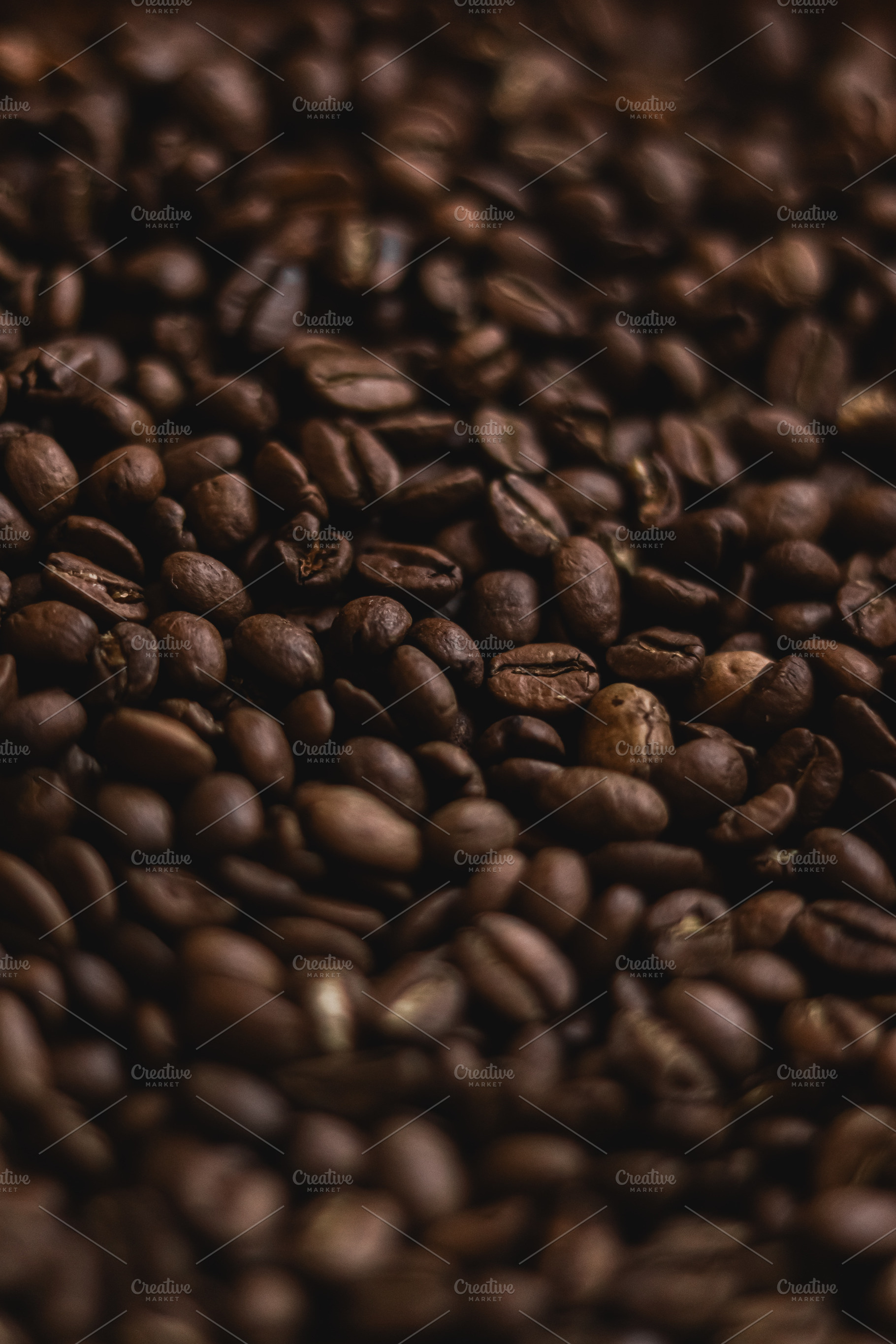 Roasted coffee beans forming a detailed surface, representing en, a Photo by Studio ANNA