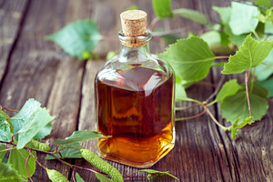 A bottle of herbal tincture made from fresh young birch leaves a