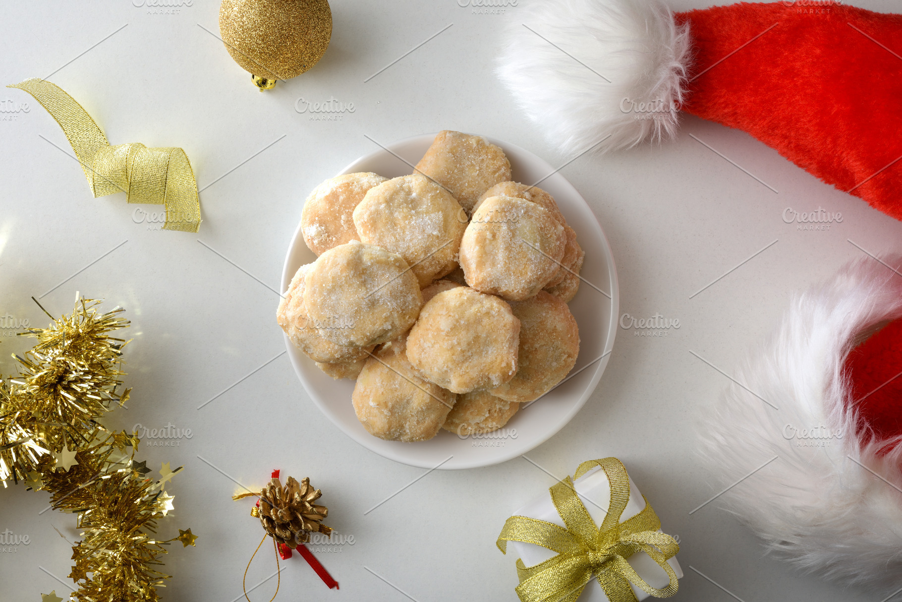 Christmas sweets in the center on white table with decoration, a Food & Drink Photo by Davizro's Market