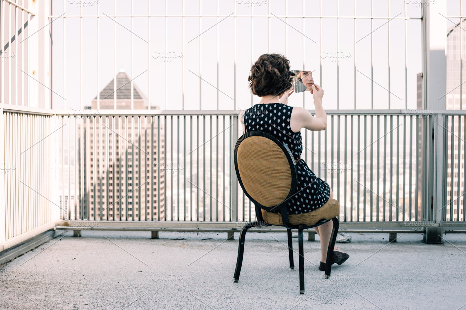 Broken mirror containing woman, dress, and polka dot
