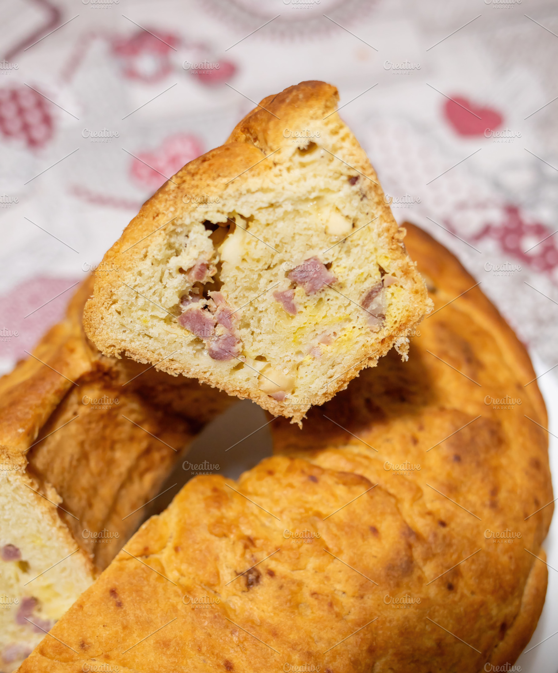 Neapolitan tortano, a slice of savory cake showing salami and cheese filling, a Food & Drink Photo by Antonio Gravante Market