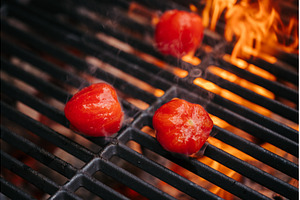 Grilling tomatoes on barbecue grill., a Food & Drink Photo by HalfPoint